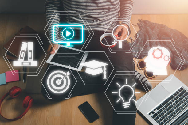 online education training, man using digital tablet on living room with vr screen education icon background, webinar online. - 电竞教育 個照片及圖片檔