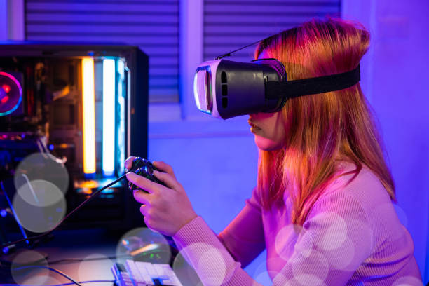 gamer in vr headset glasses exploring metaverse play video game online with joystick - 电竞 個照片及圖片檔