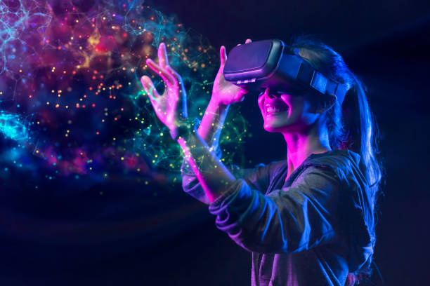 people with vr grasses playing virtual reality game. future digital technology and 3d virtual reality simulation modern futuristic lifestyle - 游戏 個照片及圖片檔